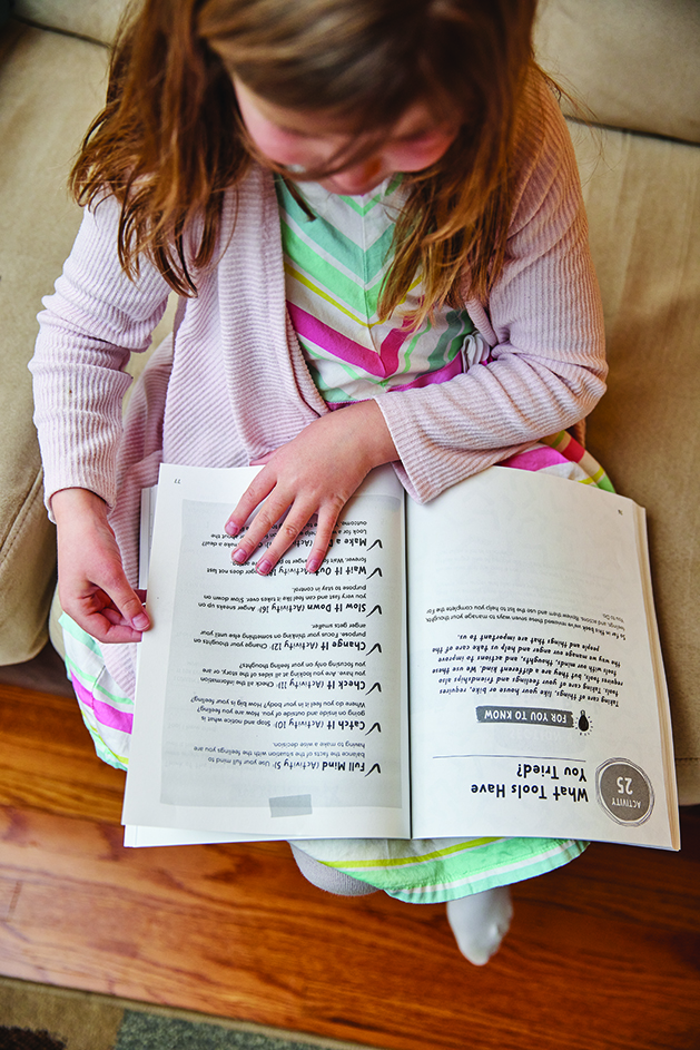 Young child using the Anger Workbook for Kids