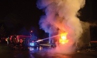 Firefighters spray a controlled burn at the Excelsior Fire District Open House.