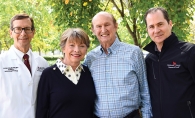 Diana and Norm Hageboeck,  center, pose with Joe Neglia, M.D.,  left, and Children’s Cancer Research  Fund CEO Daniel Gumnit, right.