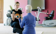 A senior citizen takes a fitness class at the Waters of Excelsior