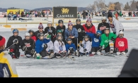 Players from the North American Pond Hockey Championship gather on the ice.