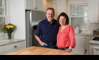 Steve and Lynne Fisher in the newly remodeled kitchen of one of their most recent house “flips.”