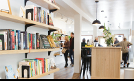 The bookshelves and bar at Cream & Amber, a new bookstore/taproom/coffee shop in Hopkins.