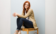 Personal stylist Jess Burke sits on a chair.