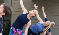 A yoga class stretches at The Marsh, Lake Minnetonka's Best Fitness Studio/Yoga Studio/Gym