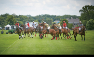 Riders on horses go for the ball during a Twin City Polo Club match.