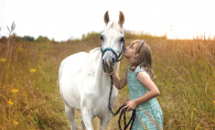A girl and a white horse