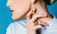 A model shows off earrings and rings from Patrick Mohs Jewelry