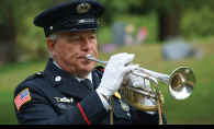 Wayzata resident Gary Marquardt plays a bugle.