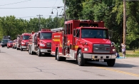 Firetrucks lined up for a parade.
