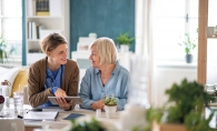 Woman talks with an elderly lady