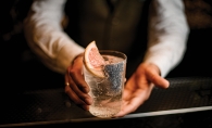 Bartender holding a cocktail