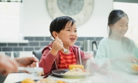 A child enjoys a meal at Taste Fore the Tour.