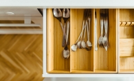 A kitchen drawer full of untensils.