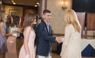 Young adults at a formal cotillion dance.