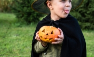 Young kid dressed to go trick-or-treating.