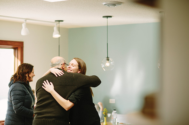 Cream & Amber founder Kacey Hruby Wyttenhove hugs Mohsen Zadeh at the shop's grand opening.