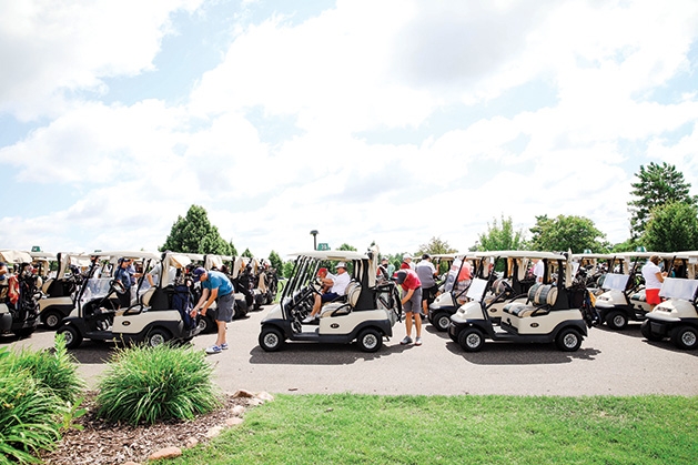 A row of golf carts at the Roger Miller Golf Classic 2019