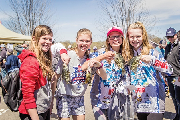 Four girls hold up their catches at the 51st Annual Minnesota Bound Crappie Contest