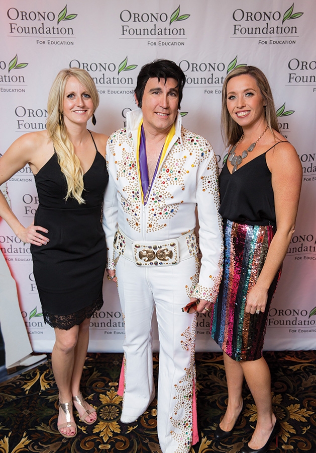 An Elvis impersonator poses with Sarah Cole and Katie Hollerman at the Orono Foundation's 2019 Red and Blue Bash