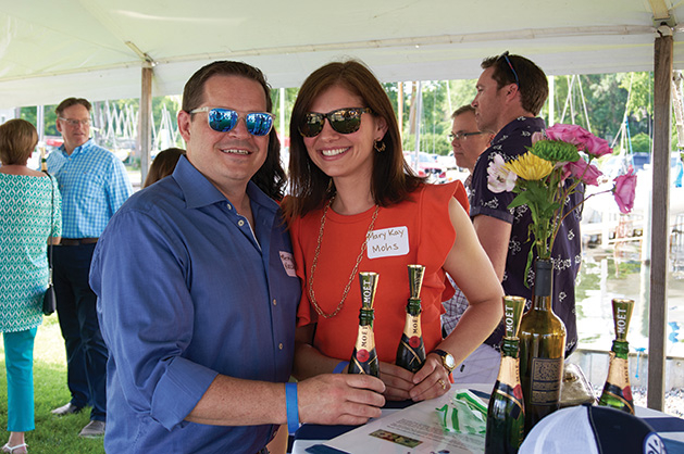 Attendees at Wine on Wayzata Bay pose for a photo.