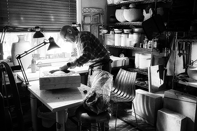 Ceramic artist Eric Pilhofer works on a piece.