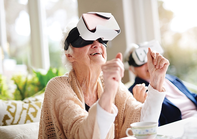 A senior at The Pillars of Shorewood Landing uses a WellnessVR headset.