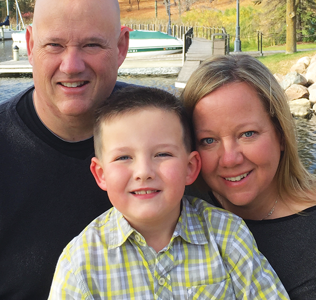 Late Wayzata police officer Bill Matthews with his son Wyatt and wife Shawn.