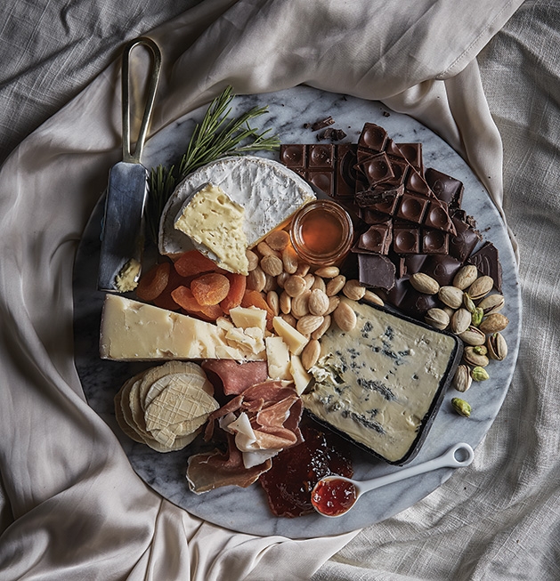 Valentine's Day spread A spread of cheese, chocolate, fruit and nuts.