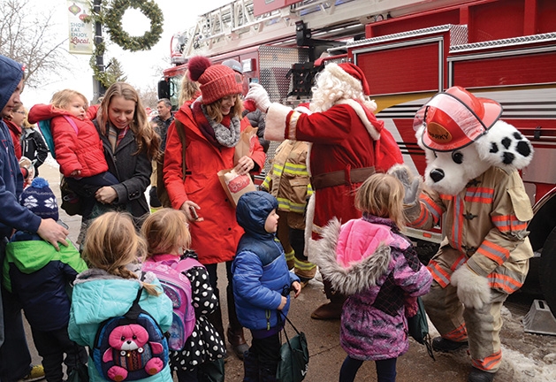 Kids meet the Excelsior Fire District mascot Sparky at a free family movie event.