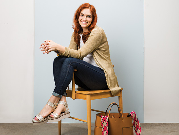 Personal stylist Jess Burke sits on a chair.