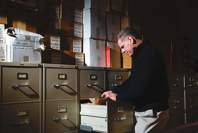 Author and Lake Minnetonka historian combs through the records at the Excelsior-Lake Minnetonka Historical Society.