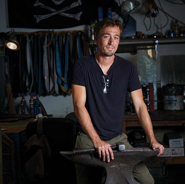 Jason Kraus, Northstar Forge Jason Kraus, owner of Northstar Forge knife-making business, stands with his forging equipment
