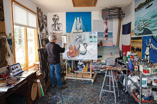 Richard Merchán Local artist Richard Merchan paints in his studio in Greenwod