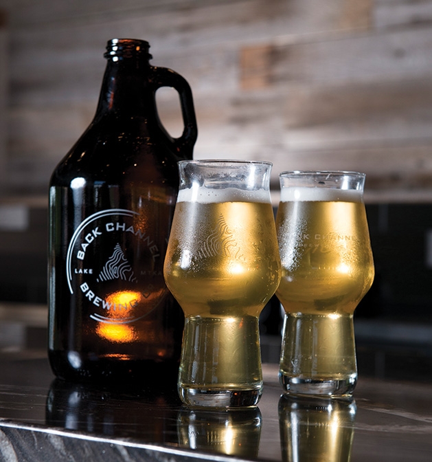 Back Channel Brewing Soviet Slayer Imperial stout Two glasses of Back Channel Brewing's Soviet Slayer imperial stout stand next to a growler.