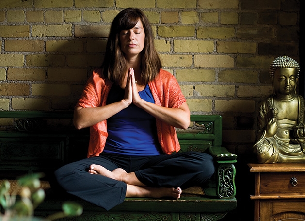 Nicole Lovald Nicole Lovald, owner of Spirit of the Lake Yoga and Wellness Center, meditates