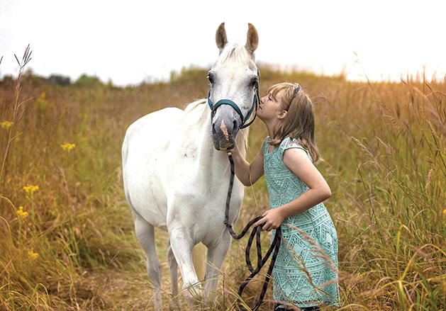 A girl and a white horse