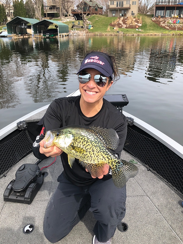 Pro angler Nicole Jacobs holds a fish