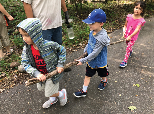 St. David's Center students work with the Minnesota DNR to clean up a forest.