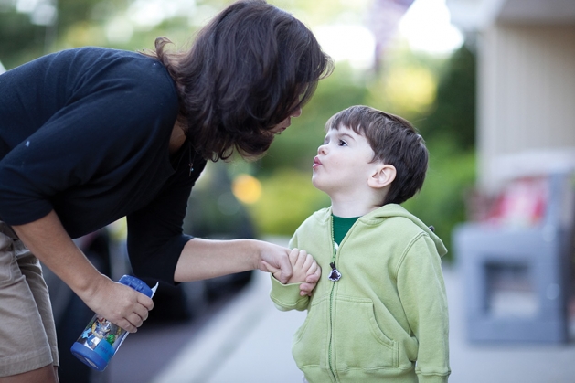 Boy and his mother saying goodbye before preschool.