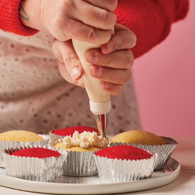 Aletta Schaefer frosting cupcakes.