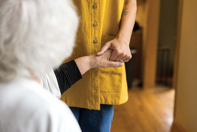 Cori Levin with two elderly clients.