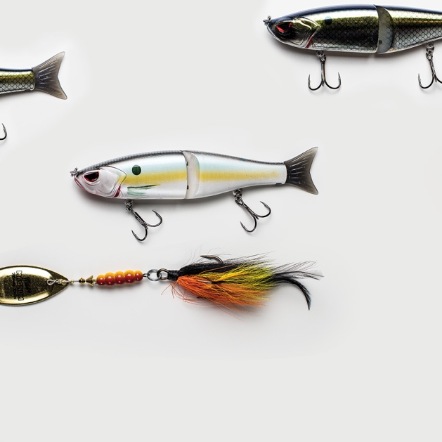 Muskie fishing lures against a white background.