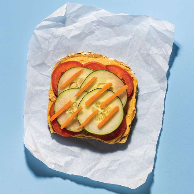 Veggie Sandwich with hummus, cucumber, carrots and tomato.