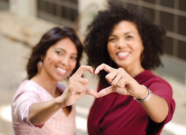 Two women at The Pink Social, an event benefiting breast cancer research.