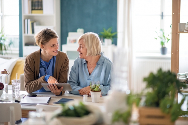 Woman talks with an elderly lady