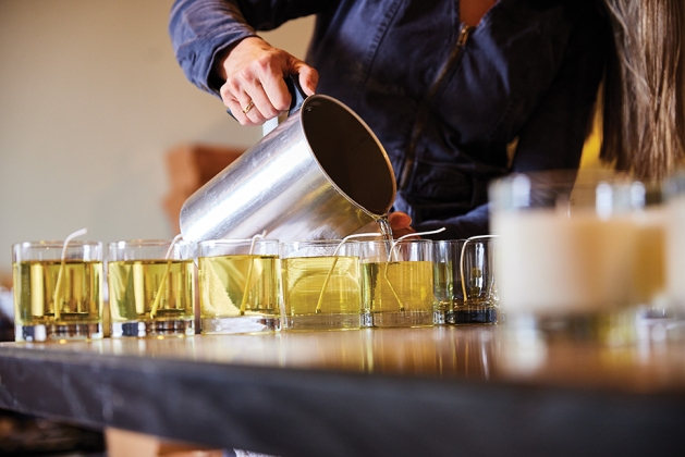 Heidi Mueller pouring candles for Excelsior Candle Co.