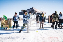 golfing with hockey sticks on ice