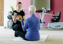 A senior citizen takes a fitness class at the Waters of Excelsior