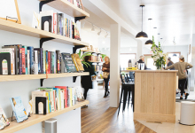 The bookshelves and community space at Cream & Amber, a Hopkins store offering books, beer, coffee and more.